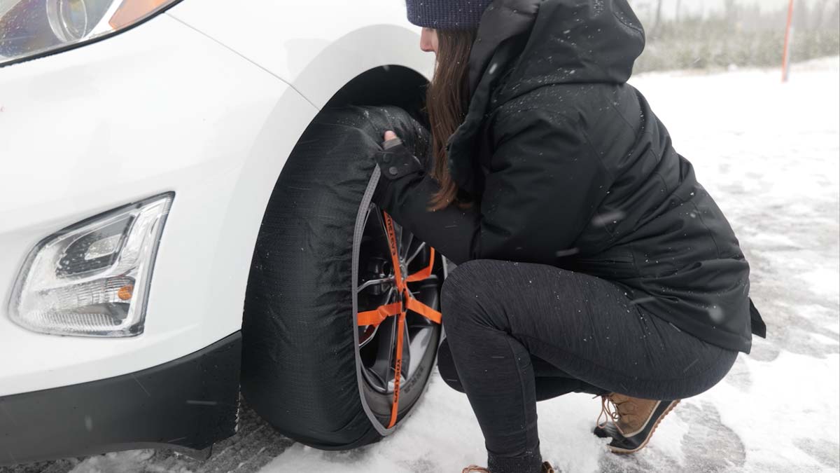 Girl installing tire sock