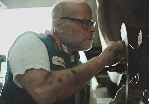 Les Schwab technician performing an inspection
