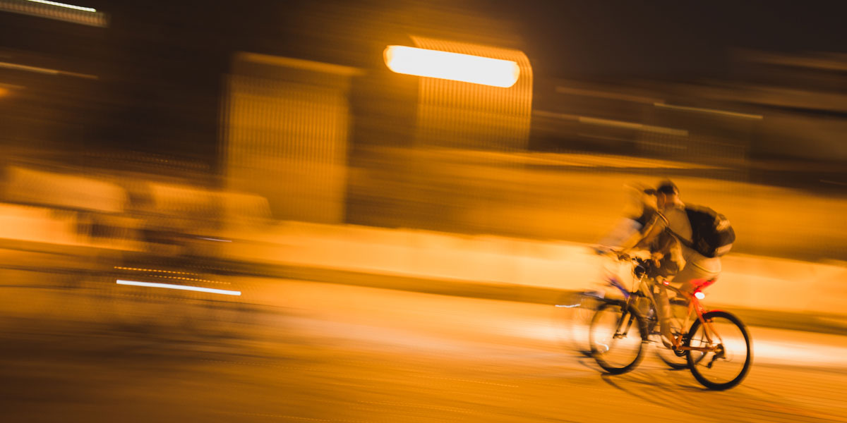 Cyclists on the road at night