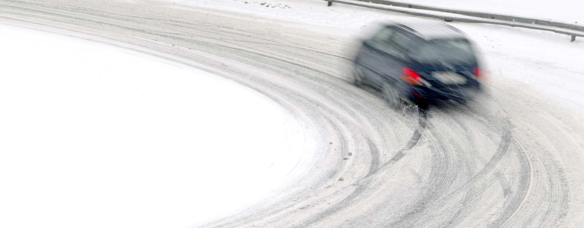 Car on snowy winter road.