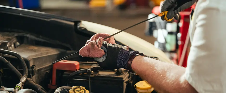 Checking oil on a dipstick