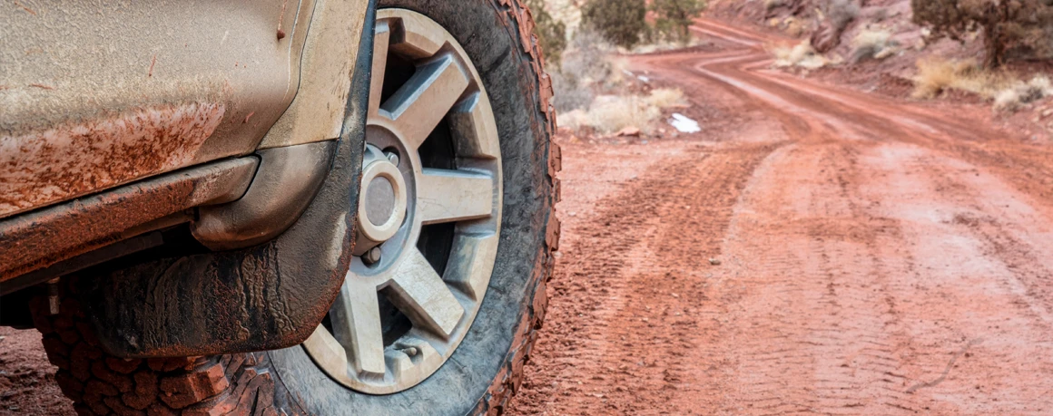 Off-road tire on a muddy rural road