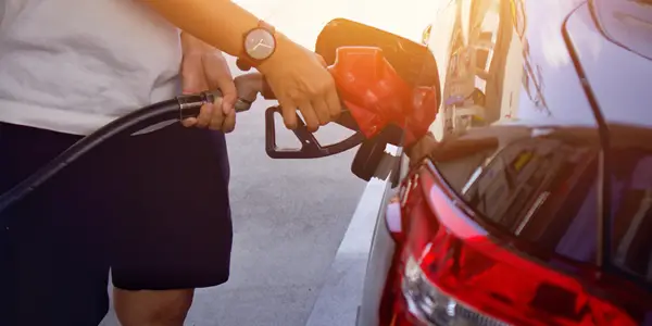 Person filling up gas tank