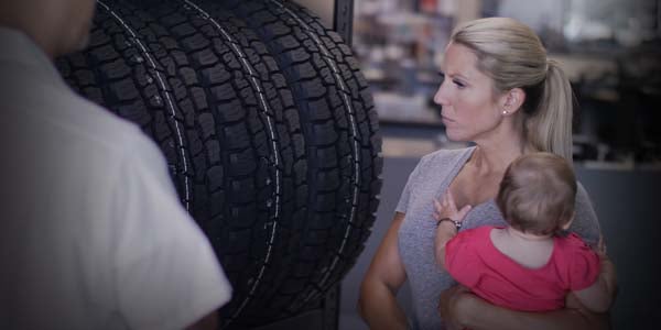 Woman searching for new tires