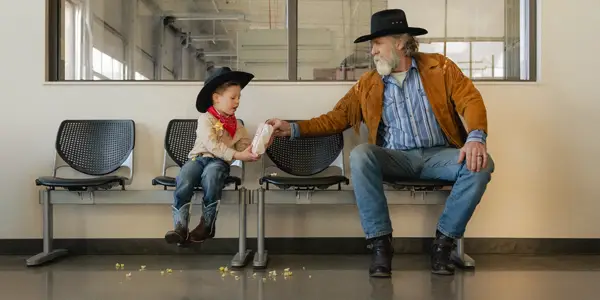 Cowboys enjoying popcorn together