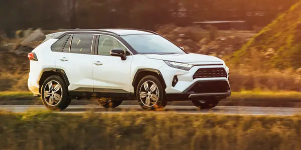 All-wheel-drive (AWD) vehicle travels along scenic roadway