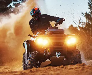 ATV being ridden on sand dune