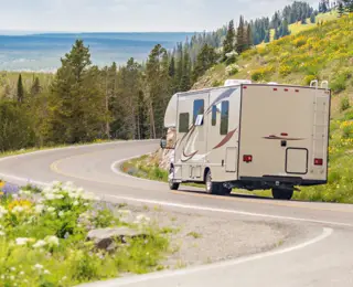 A motorhome traveling on a mountain road.