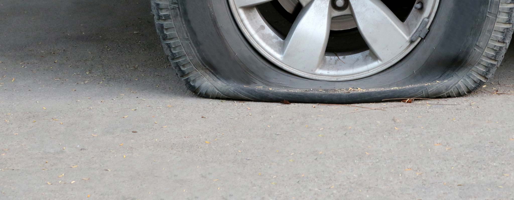 A flat tire on a car.