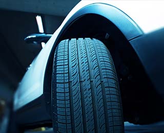 Close up of a front tire on a vehicle.