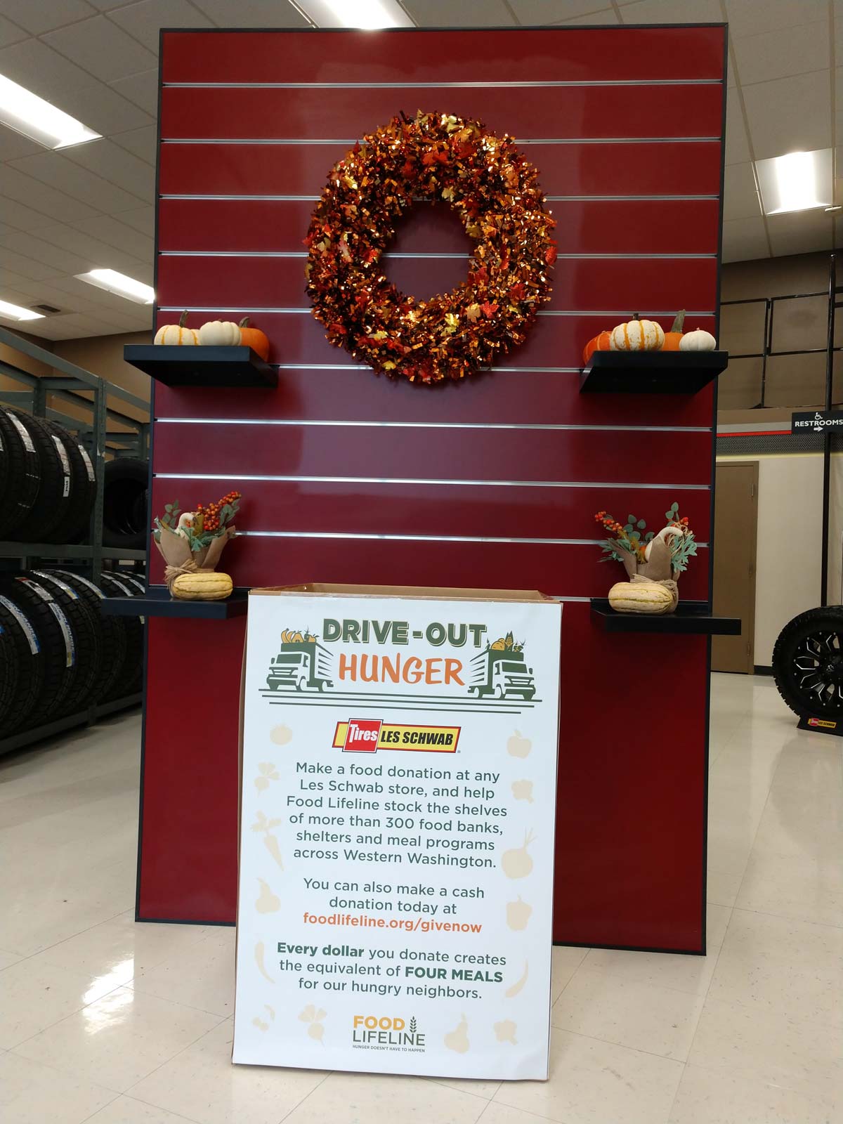 Food Lifeline food drive display in a Les Schwab store.