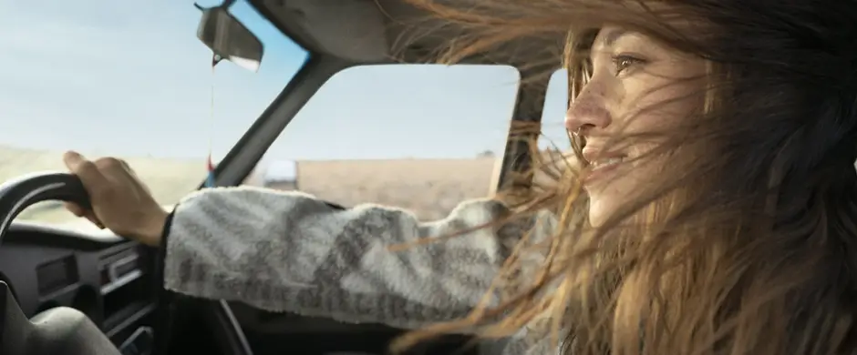 Lady driving with the windows down