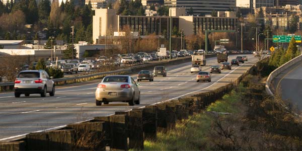 Highway with cars driving on it.