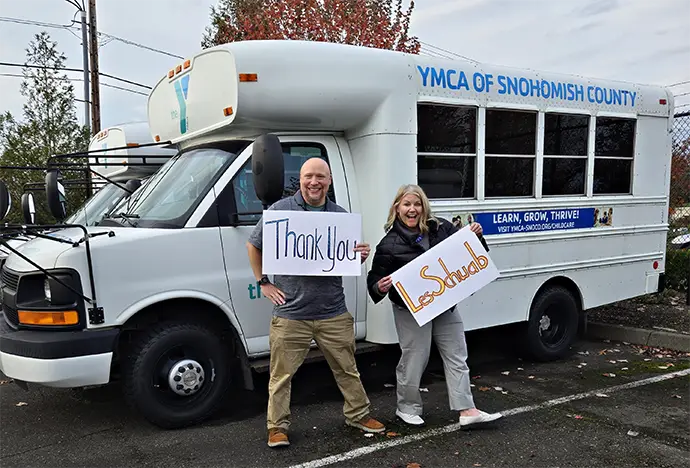 YMCA of Snohomish County Employees in front of vans