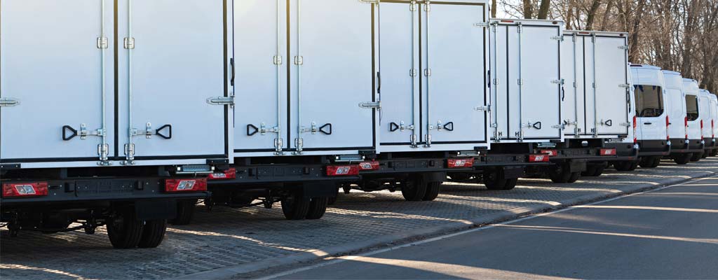 The back of a row of fleet trucks.