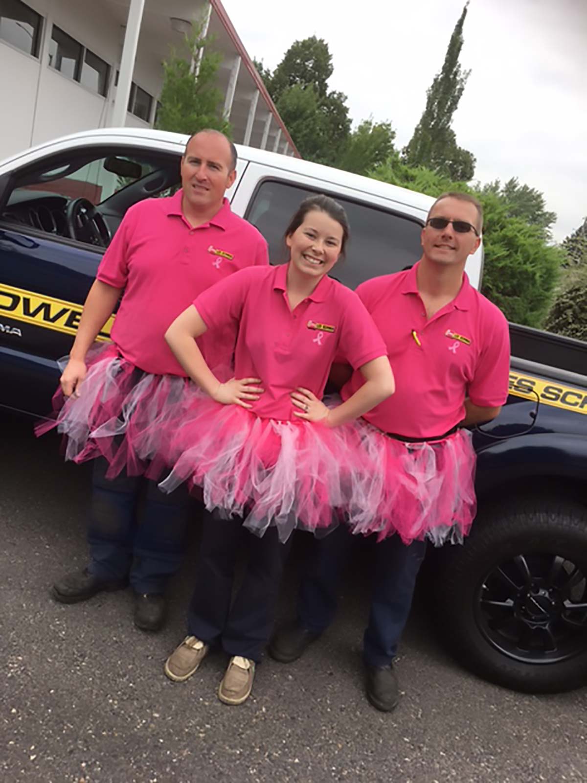 Les Schwab employees support the cause with pink tutus