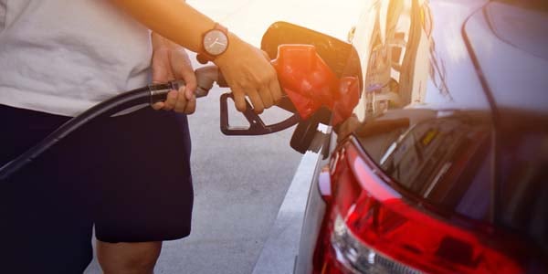 Person filling up gas tank