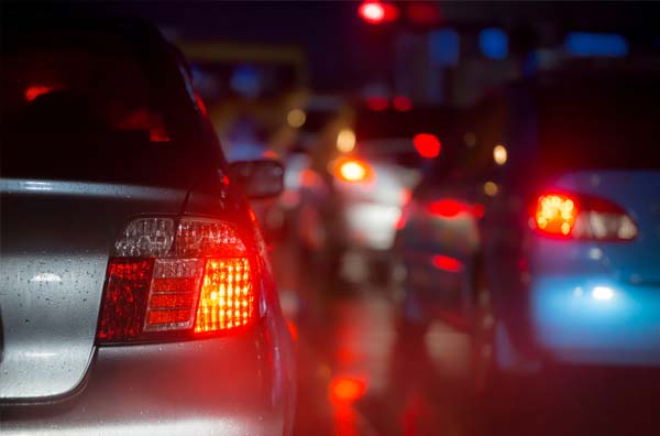 Car brake lights at night.