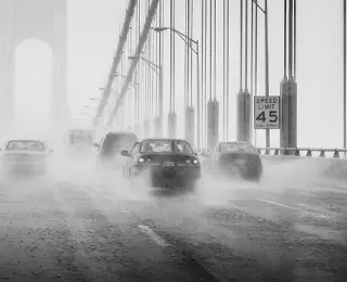 Cars driving in heavy rain and standing water