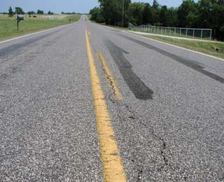 Tire skid marks on a rural road.